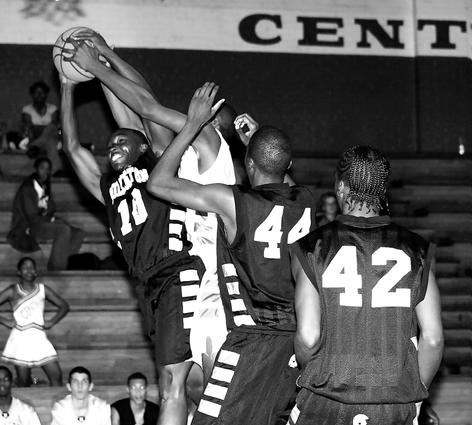 Millington's Keith Brown fights for a rebound.