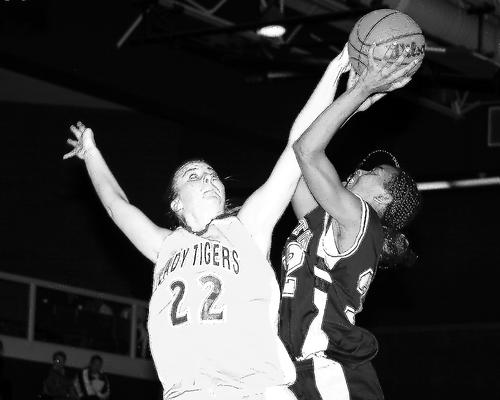 Aisha Adams shots over a Caldwell defender.