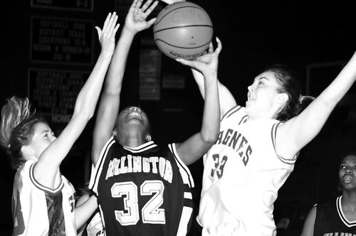 Aisha Adams of Millington battles for the rebound.