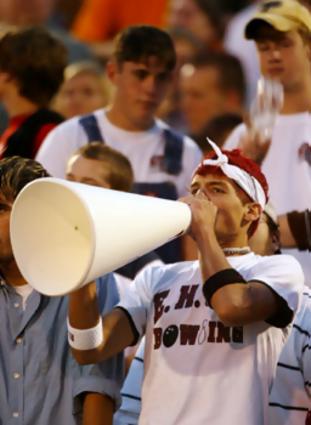 Cody Doores cheers for the Eagles of Ezell Harding during their game against the Knights from Pope John Paul II at Ezell Harding High School. (Photo by George Walker IV/Staff)