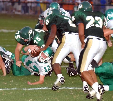Midway's Jeremy Woody stretches for extra yardage.