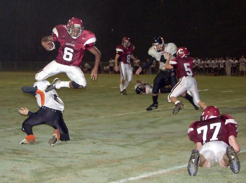 Cheatham running back Michael Johnson (6) leaps over a Richland defender for one of  his two touchdown runs.