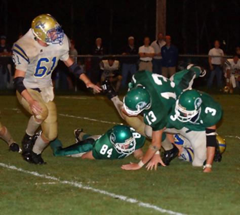 Midway's Jude O'Toole dives over the pile.