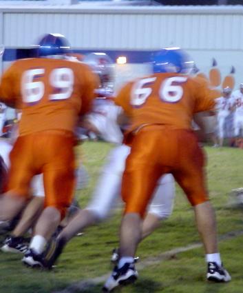 Cougar Center Toby Young #69 & LG Josh Evans #66 blew holes through the Scott Co. defense, allowing Chris Johnson to rush for a school record 264 yards.