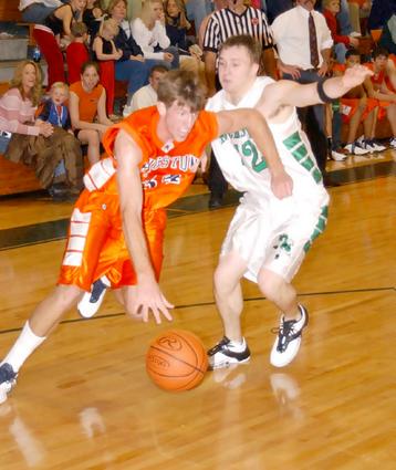 Justin Sitzlar drives past Jacob Richardson.