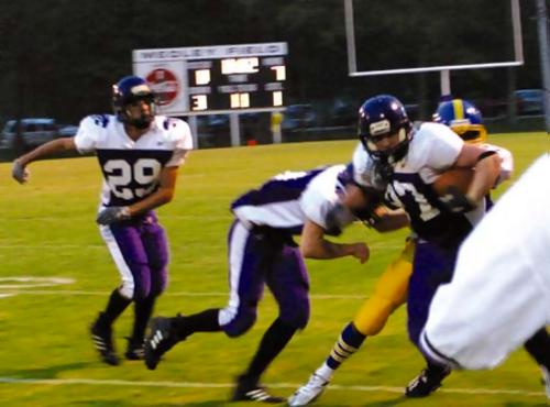 Senior Seth Crabtree (#87) running hard for MHS