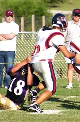 TRA's Cary Porter is tackled by LCA's Tim VanDouser.