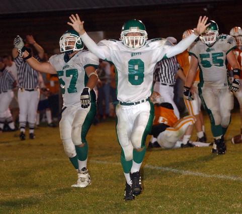 Midway's Andrew Davidson celebrates after Jon Russell's sack ended Oneida's final chance at victory.