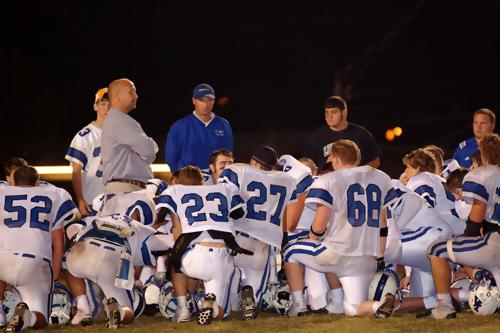 Coach congratulates his team