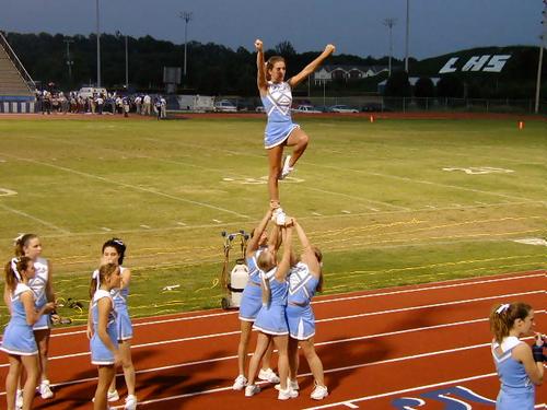 Stevie Sweeney rises high to cheer for the Jets