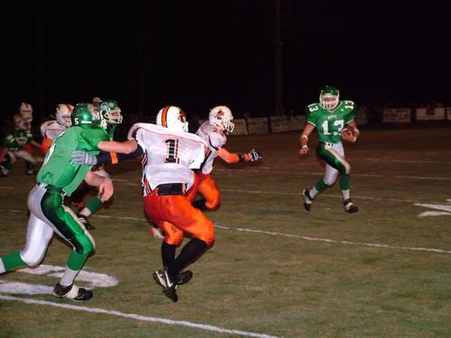 Jude runs around end.