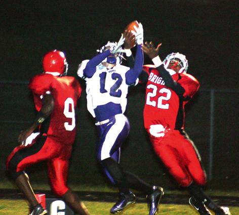 Ripley's Blake McAdams goes up for a catch against Brighton defender Jeff Wilson as No. 9 Johnny Douglas watches.