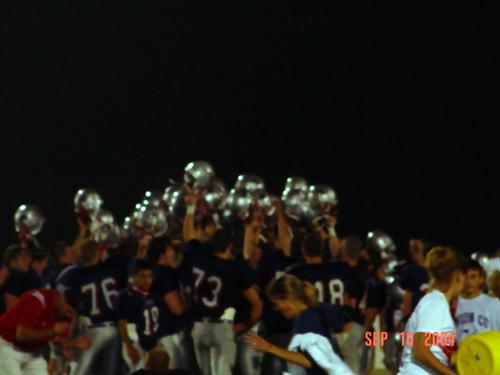 Patriots sing their fight song on the 50 after every victory