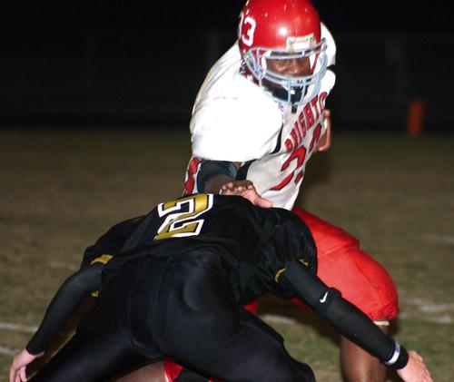 Brighton's Tim Stark tries to run over Millington's Jesse Ferrell.