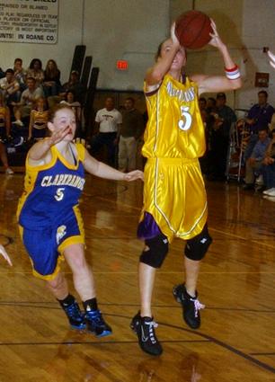 Oliver Springs' Katie Davis pulls up on a fast break.