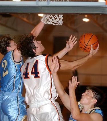 Kingston's Derek Rogers puts up a reverse lay-up.
