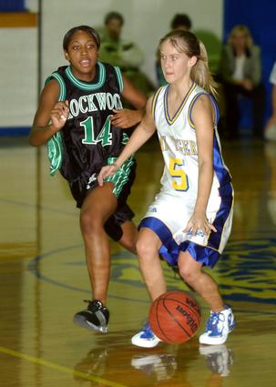 Sunbright's Jessica Morgan moves past Rockwood's Teddy Chatman.