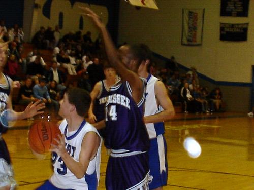 Steven Fowler (white 23) under the basket