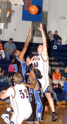 Kingston's Matt Poole puts in a short jumper.
