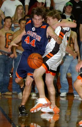 Kingston's Derek Rogers drives the base line.