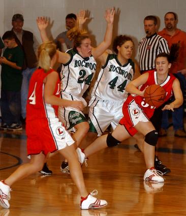 Rockwood's Shae Springs and Kirsten Raby double team a Loudon player.