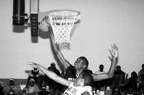 Trojan Jermaine Dailey makes a block on Wolf Josh Shotwell.