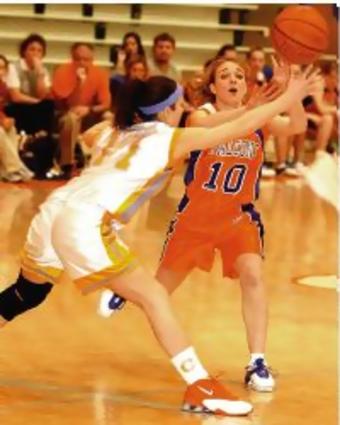 SULLIVAN CENTRAL'S #11 BETH SHELTON PUTS PRESSURE ON VOLUNTEER'S #10 ASHLEY BENNETT DURING THE 1ST ROUND OF THE DISTRICT 1-AA GIRLS BASKETBALL TOURNAMENT