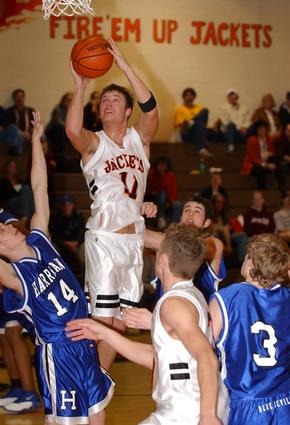 Ricky Lowe goes above the Harriman defense.