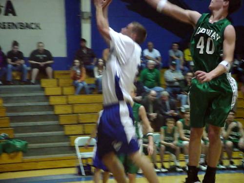 Kevin Hall (white 21) makes a layup