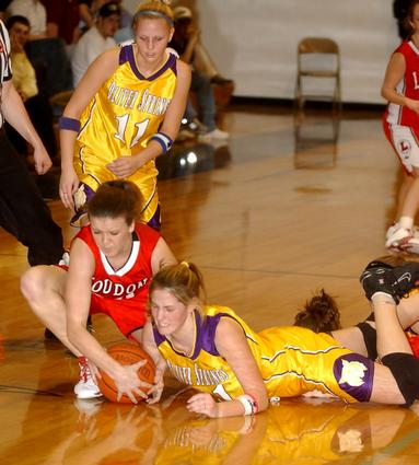 OS junior Arielle Lankford battles a Loudon player for a loose ball.