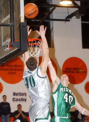 Rockwood's jamie Hackler goes up for an alley-oop.