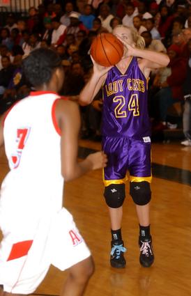 Kara Monk puts up a three-pointer for OS.