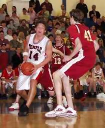 Seth Skogen of Temple goes baseline against Carter McMasters of Grace.