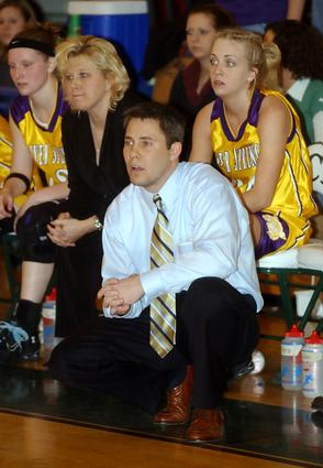 OS head coach Todd Wright looks on.