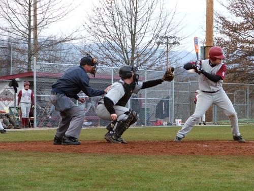 OS's Ryan Bunch protecting the umpire