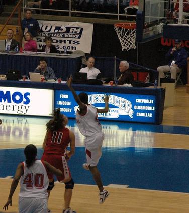 #4 A.E. Goss goes for the shot fake by #11 Jenna Roney