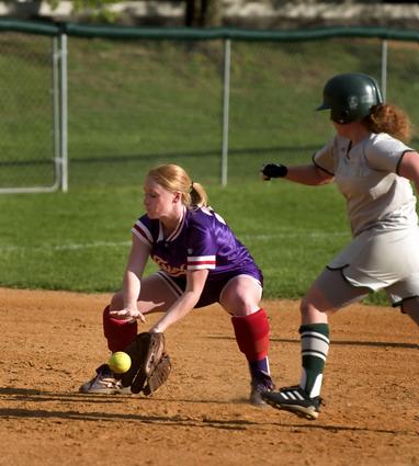 Emily Miller scoops up a ground er before making the throw to 3rd for an out.
