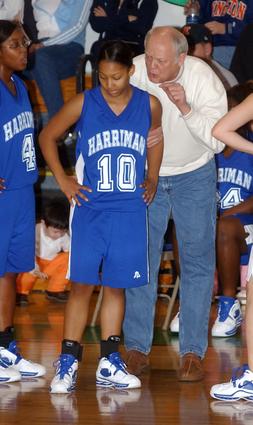 Harriman head coach Jim Cordell talks with Tiara Eskridge.