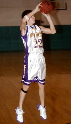Oliver Springs' Ryan Dulling fires a three-pointer.