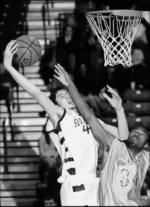 Brainerd's Jonathan White (34) and Soddy Daisy's Billy Darden battle for rebound in Brainerd's win over SD 52-43.