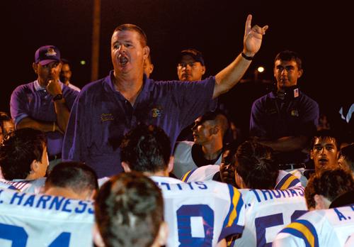Bobcat head coach Frank Johnson talks with his squad after Friday's victory at Coalfield.
