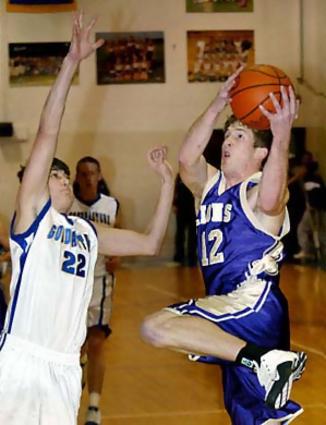 CPA's Travis Sikes, right, goes to the hoop past Goodpasture's Chris Buchanan during the first half in Madison, Tenn., Friday, Jan. 14, 2005.
