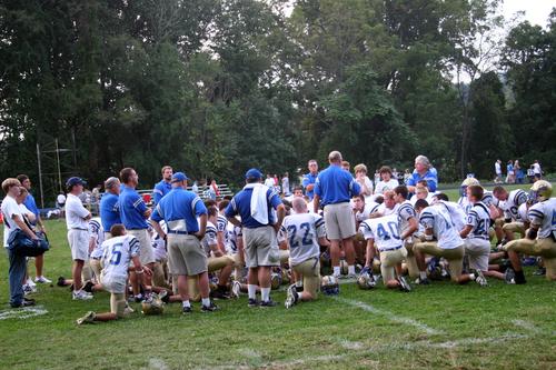 Coach Bill Young talks to the team after the game
