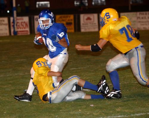 Harriman's Damian Miller tries to get past the Sunbright defense.