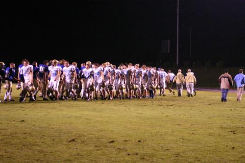 The Jets and Beavers shake hands