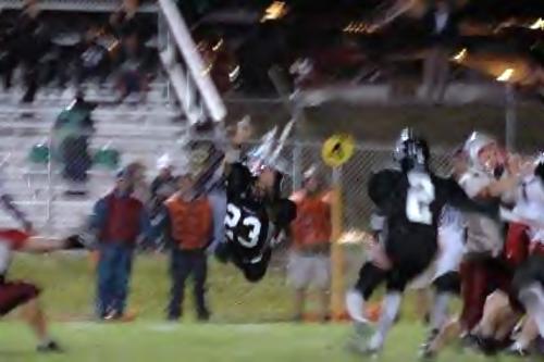 Carter defender trying to block a UC fieldgoal.