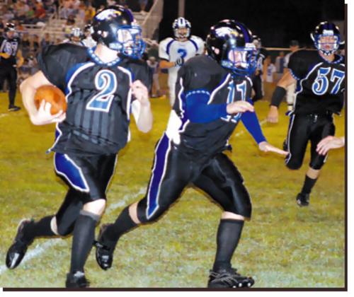 Cosby's Derek Coleman following behind blocker Mathew McGaha
