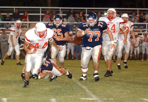 Kingston's Brandon Quillen brings down Wesley Smith.