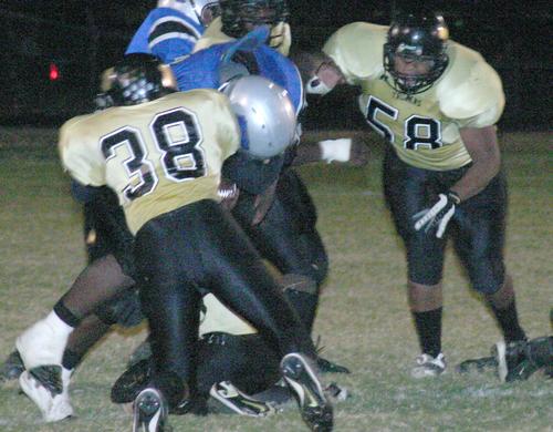 Millington's Melvin Johnson makes a stop.