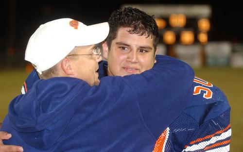 Kingston defensive coordinator Robbie Collier says good bye to senior Austin Owens.